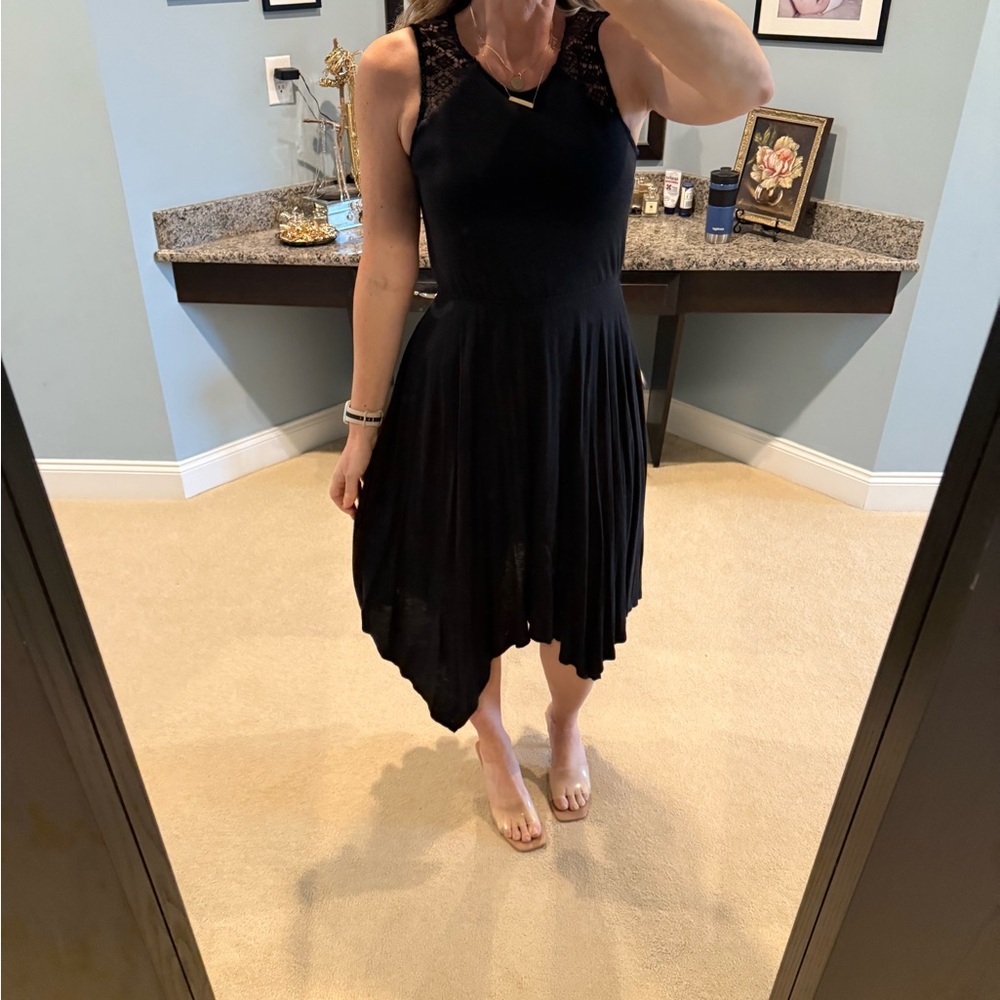 Black dress with asymmetric hem line and lace detail size XS